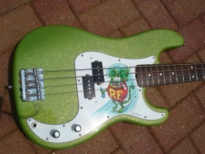 Rat fink guitar bass from naked body guitars painted with limetreuse metal flake.