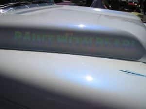 White hood with a blue ghost effect.