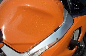 Gsxr tank with orange and holographic flake.