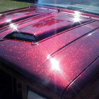 Rose Red Metal Flake paint on hood of Ford Explorer.