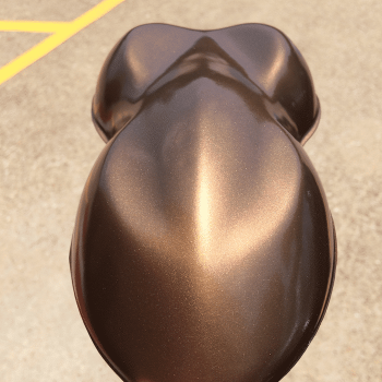 Nut Brown candy paint pearls sprayed on a speed shape, or car shape test panel.