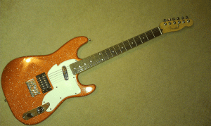 This is a custom paint job using our metal flake guitar paint additive, orange copper metal flake.